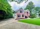 Beautiful two-story brick home with attached garage and long driveway at 1345 Starboard Way, Cumming, GA 30041