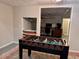 Basement game room area featuring a foosball table and a pass-through at 1345 Starboard Way, Cumming, GA 30041