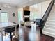Comfortable living room is adjacent to eat-in kitchen and features a stone fireplace and floor-to-ceiling windows at 1345 Starboard Way, Cumming, GA 30041