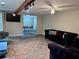 Spacious living room with large rug, comfortable seating and view of the dining room at 1345 Starboard Way, Cumming, GA 30041