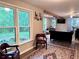 View of the living room featuring hardwood floors, bright windows, and comfortable seating at 1345 Starboard Way, Cumming, GA 30041