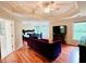 Spacious main bedroom features a sitting area, tray ceilings, and hardwood floors at 1345 Starboard Way, Cumming, GA 30041