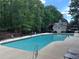 Community pool with lounge chairs offers a refreshing escape at 1345 Starboard Way, Cumming, GA 30041