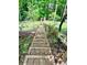 Steep outdoor staircase provides access from the backyard to the property at 1345 Starboard Way, Cumming, GA 30041