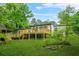 Home exterior with a spacious backyard and deck, ideal for outdoor living at 1712 Venetian Sw Dr, Atlanta, GA 30311