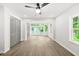 Bright bedroom featuring wood flooring, recessed lights, double closets and a window with exterior view at 1712 Venetian Sw Dr, Atlanta, GA 30311
