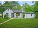 Charming bungalow with a freshly manicured lawn and meticulously maintained landscaping at 1712 Venetian Sw Dr, Atlanta, GA 30311