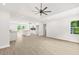 Bright, open-concept living area with new floors, recessed lighting, and a modern ceiling fan at 1712 Venetian Sw Dr, Atlanta, GA 30311