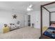 Bright bedroom with natural light, four-poster bed, neutral carpet, and plenty of storage at 2270 Emerald Dr, Jonesboro, GA 30236
