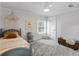 Charming bedroom featuring a cozy bed with a decorative canopy, complemented by neutral walls and a ceiling fan at 2270 Emerald Dr, Jonesboro, GA 30236