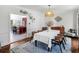 Dining room with hard wood floors and view into open kitchen with central island at 2270 Emerald Dr, Jonesboro, GA 30236