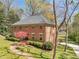 Stately brick home with a lush front lawn and a charming brick walkway to the front door at 2270 Emerald Dr, Jonesboro, GA 30236