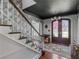 Stylish foyer boasting hardwood floors, a staircase, and a view of the front door at 2270 Emerald Dr, Jonesboro, GA 30236