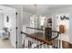 Open hallway featuring hardwood floors, custom light fixture, with access to multiple rooms in the home at 2270 Emerald Dr, Jonesboro, GA 30236
