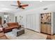 Inviting living room features a bar, hardwood floors, stylish sofas, and a ceiling fan at 2270 Emerald Dr, Jonesboro, GA 30236