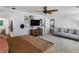 Well-lit main bedroom showcasing a ceiling fan, media center, and sitting area with modern decor at 2270 Emerald Dr, Jonesboro, GA 30236