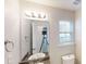 Bathroom featuring a large mirror, granite countertop, and modern fixtures at 4884 Antelope Cv, Atlanta, GA 30349