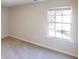 Cozy bedroom featuring neutral carpet, light-filled window, and ample wall space at 4884 Antelope Cv, Atlanta, GA 30349