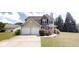 Charming two-story home with vinyl siding, a brick facade, a two-car garage, and well-maintained landscaping at 4884 Antelope Cv, Atlanta, GA 30349