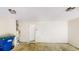 View of the two car garage with a utility door and blue trash cans at 4884 Antelope Cv, Atlanta, GA 30349