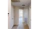 Hallway with neutral paint and carpet leading to bedrooms and living area at 4884 Antelope Cv, Atlanta, GA 30349
