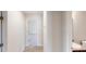 Hallway with neutral paint and carpet leading to bedrooms and bathroom at 4884 Antelope Cv, Atlanta, GA 30349