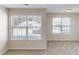 Bright living room with carpet and large windows allowing natural light at 4884 Antelope Cv, Atlanta, GA 30349