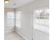 Bright living room with tile flooring and large windows allowing natural light at 4884 Antelope Cv, Atlanta, GA 30349