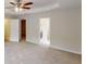 Spacious main bedroom boasts a ceiling fan, neutral carpet, and access to ensuite bathroom and walk-in closet at 4884 Antelope Cv, Atlanta, GA 30349