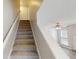 Carpeted staircase leading to the upper level, with a view of the living room at 4884 Antelope Cv, Atlanta, GA 30349