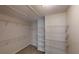 This roomy walk-in closet features carpeted floors and plentiful adjustable wire shelving for organized storage at 4884 Antelope Cv, Atlanta, GA 30349