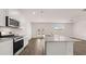 This open kitchen has granite countertops, stainless steel appliances, and ample counter space at 616 Kimberwick Dr, Locust Grove, GA 30248