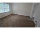 Clean bedroom with carpet flooring, neutral paint, and natural light at 639 Royal Abbey Dr, Stone Mountain, GA 30088