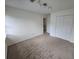 Bright bedroom featuring carpet, natural light, and a closet, offering ample storage space at 639 Royal Abbey Dr, Stone Mountain, GA 30088