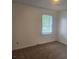 Neutral bedroom with a large window and natural light for a bright and airy space at 639 Royal Abbey Dr, Stone Mountain, GA 30088