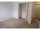 Cozy bedroom featuring a closet and adjacent doorways, offering convenient access at 639 Royal Abbey Dr, Stone Mountain, GA 30088
