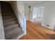 Charming entryway featuring hardwood floors, carpeted stairs and freshly painted walls at 639 Royal Abbey Dr, Stone Mountain, GA 30088