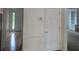 Hallway with hardwood floors, leading to the living spaces at 639 Royal Abbey Dr, Stone Mountain, GA 30088