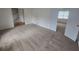 Inviting living room showcasing neutral paint and plush carpeting leading to the staircase at 639 Royal Abbey Dr, Stone Mountain, GA 30088