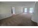 Bright living room with carpet flooring, and fresh, neutral paint at 639 Royal Abbey Dr, Stone Mountain, GA 30088