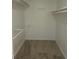 Spacious walk-in closet offering ample shelving and storage solutions at 639 Royal Abbey Dr, Stone Mountain, GA 30088
