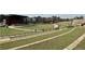 Amphitheater with an open green space, stage, and tiered seating for community events and performances at 217 Napa Dr, Woodstock, GA 30188