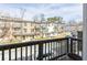 Balcony view overlooking a charming street with well-maintained buildings and greenery at 217 Napa Dr, Woodstock, GA 30188