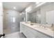 Spacious bathroom features a double sink vanity, quartz countertop and large walk-in shower at 217 Napa Dr, Woodstock, GA 30188