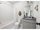Well lit bathroom featuring a shower-tub combo and modern vanity at 217 Napa Dr, Woodstock, GA 30188