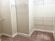 Carpeted walk-in closet with white, wire shelving for organized storage space at 217 Napa Dr, Woodstock, GA 30188