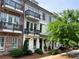 Exterior of a 3 story condo building with small balconies and well-maintained landscaping at 217 Napa Dr, Woodstock, GA 30188