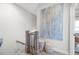 Bright hallway features stairs, neutral paint, art and matching decorative baskets at 217 Napa Dr, Woodstock, GA 30188