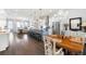 Spacious open floor plan with a modern kitchen, island seating, and a view into the living area at 217 Napa Dr, Woodstock, GA 30188