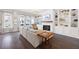 Bright living room with hardwood floors, built-in shelves, fireplace, and large windows providing natural light at 217 Napa Dr, Woodstock, GA 30188